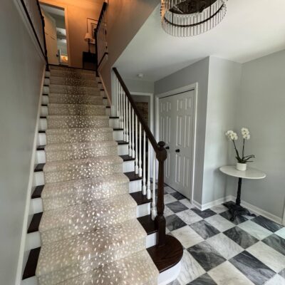 View looking up stairs with stair runner