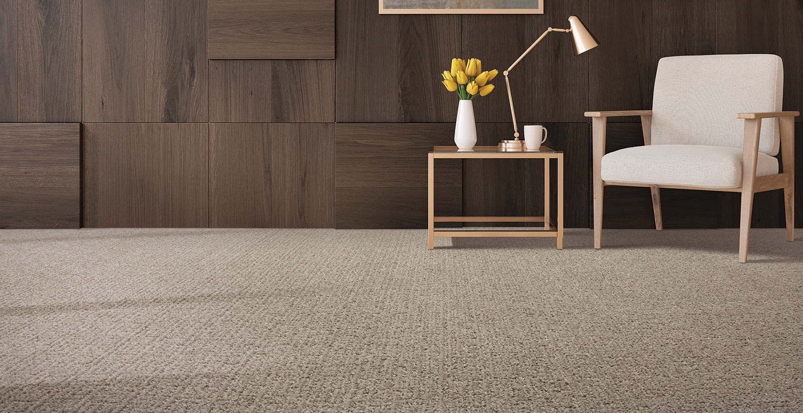 Midcentury modern looking room with light gray carpet, white chair with wood arms, and dark wood wall.